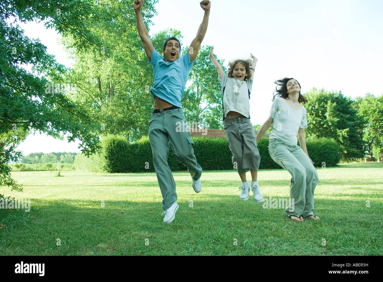 Child jumping fathers arms hi-res stock photography and images - Alamy