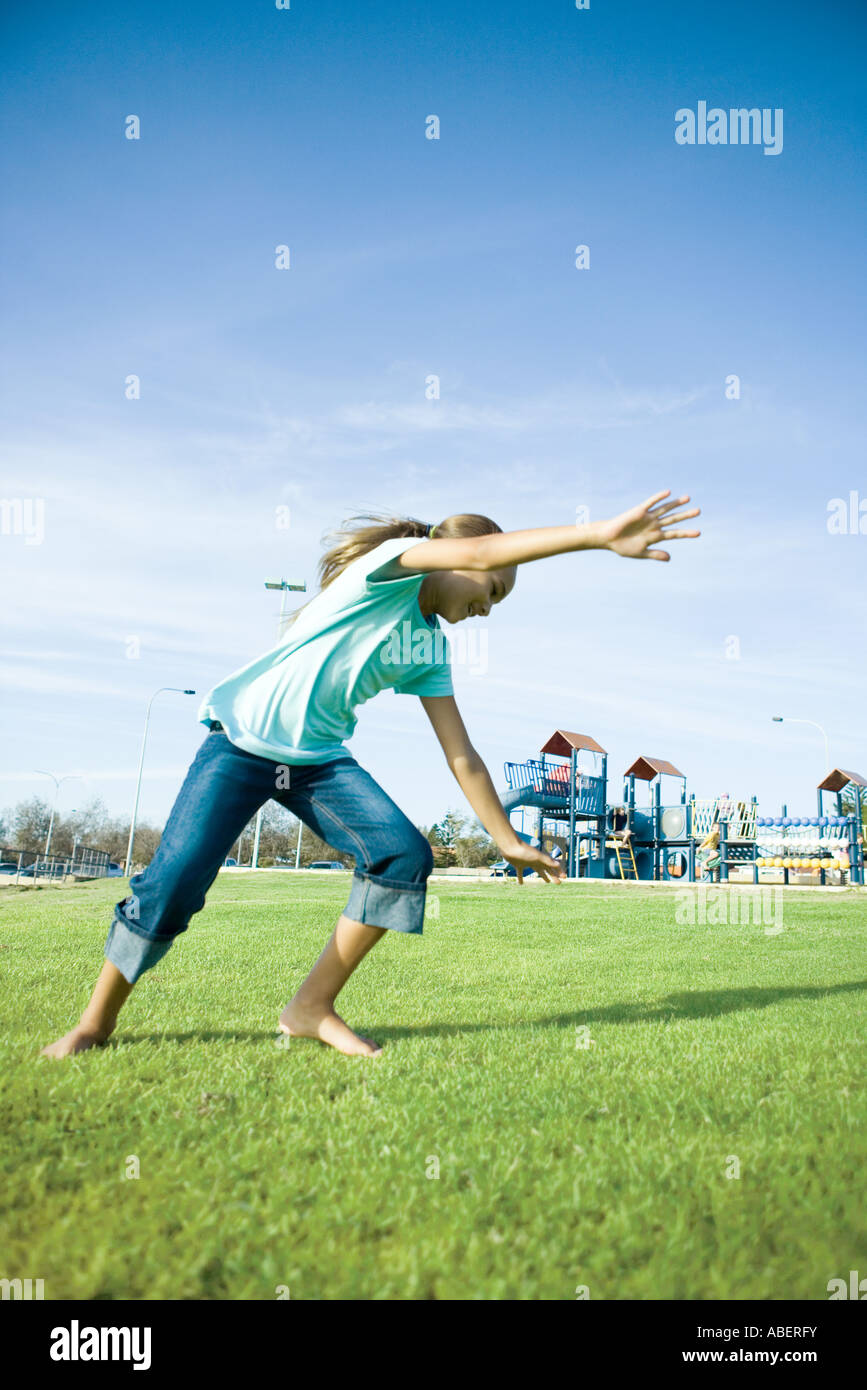 Girl doing cartwheel on grass Stock Photo Alamy