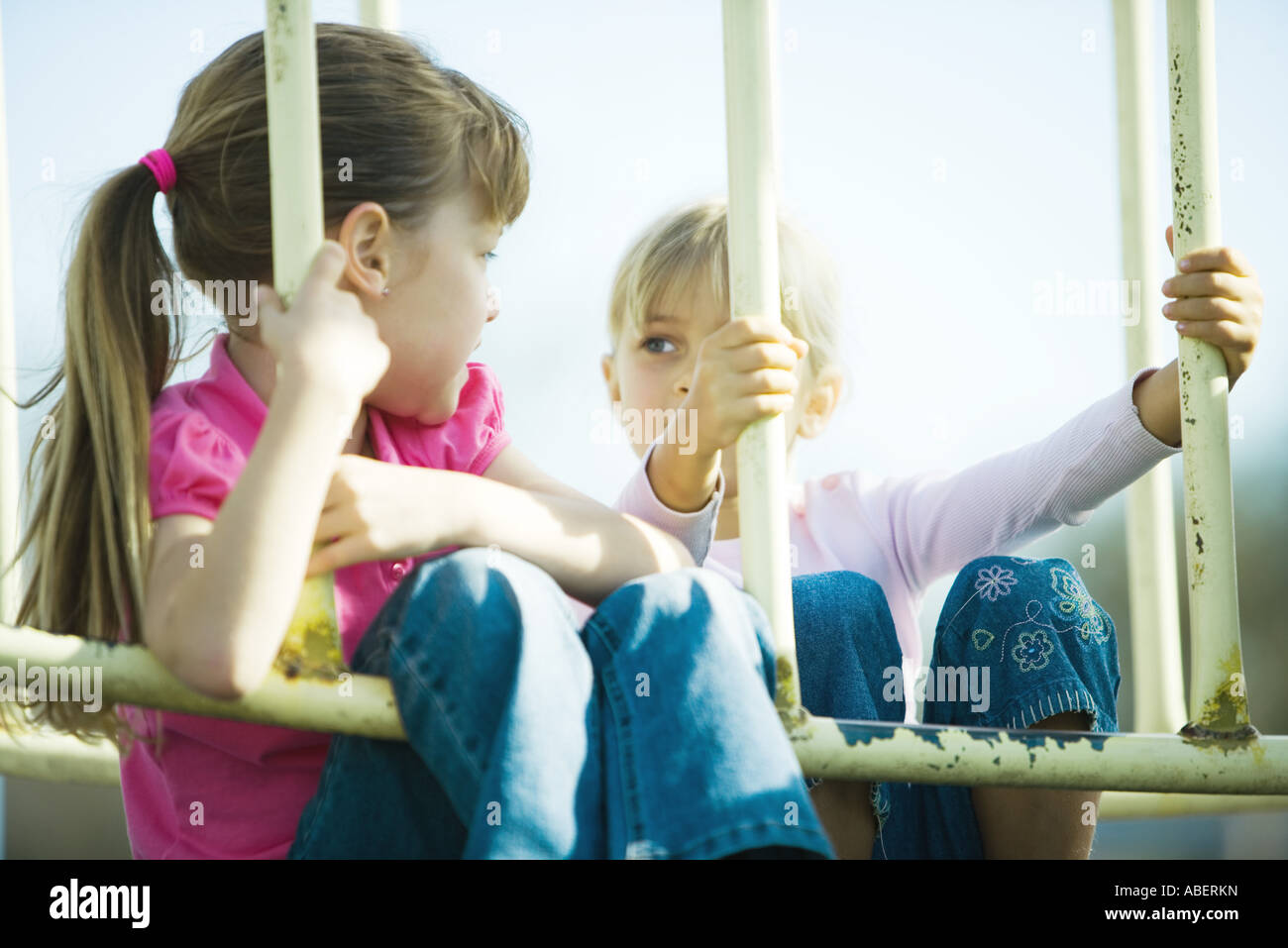 Children on playground equipment Stock Photo