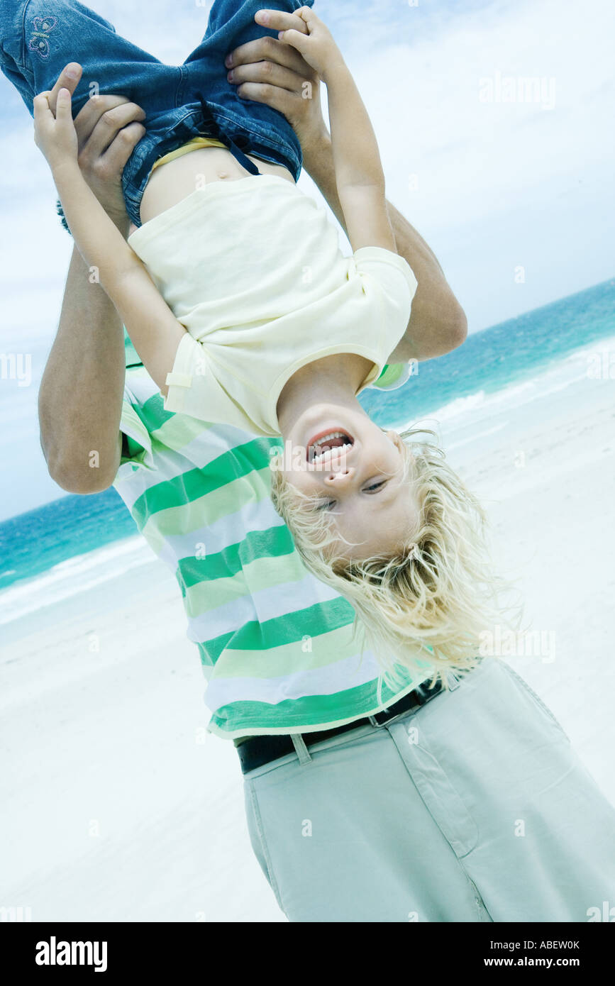 Man hanging upside down from hi-res stock photography and images - Alamy