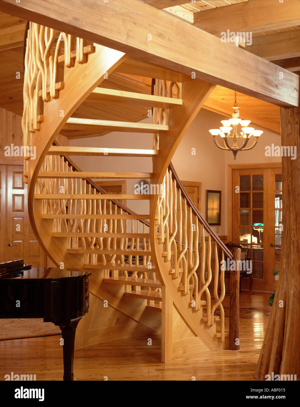 Custom artisan wood staircase installed in residential home Stock Photo