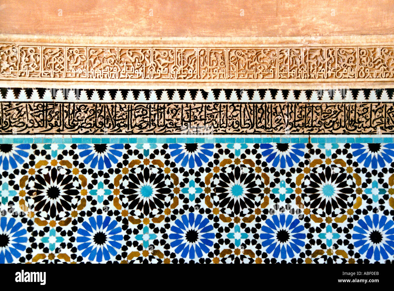 Arabic wall detail and coloured tiles in the Saadian tombs of Marrakech