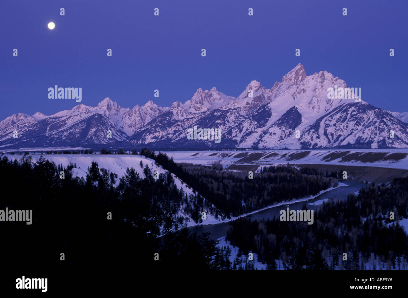 Snake River Overlook Grand Teton N P A full moon sets behind the Tetons