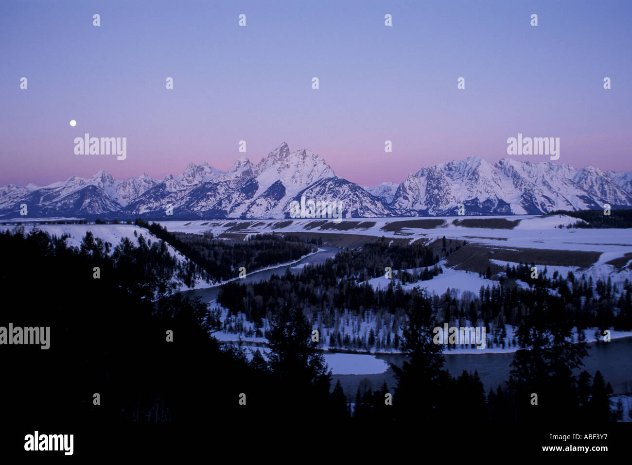 Snake River Overlook Grand Teton N P A full moon sets behind the Tetons