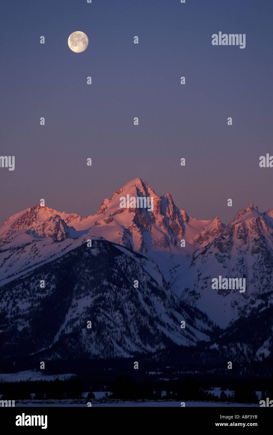 Snake River Overlook Grand Teton N P A full moon sets behind the Tetons