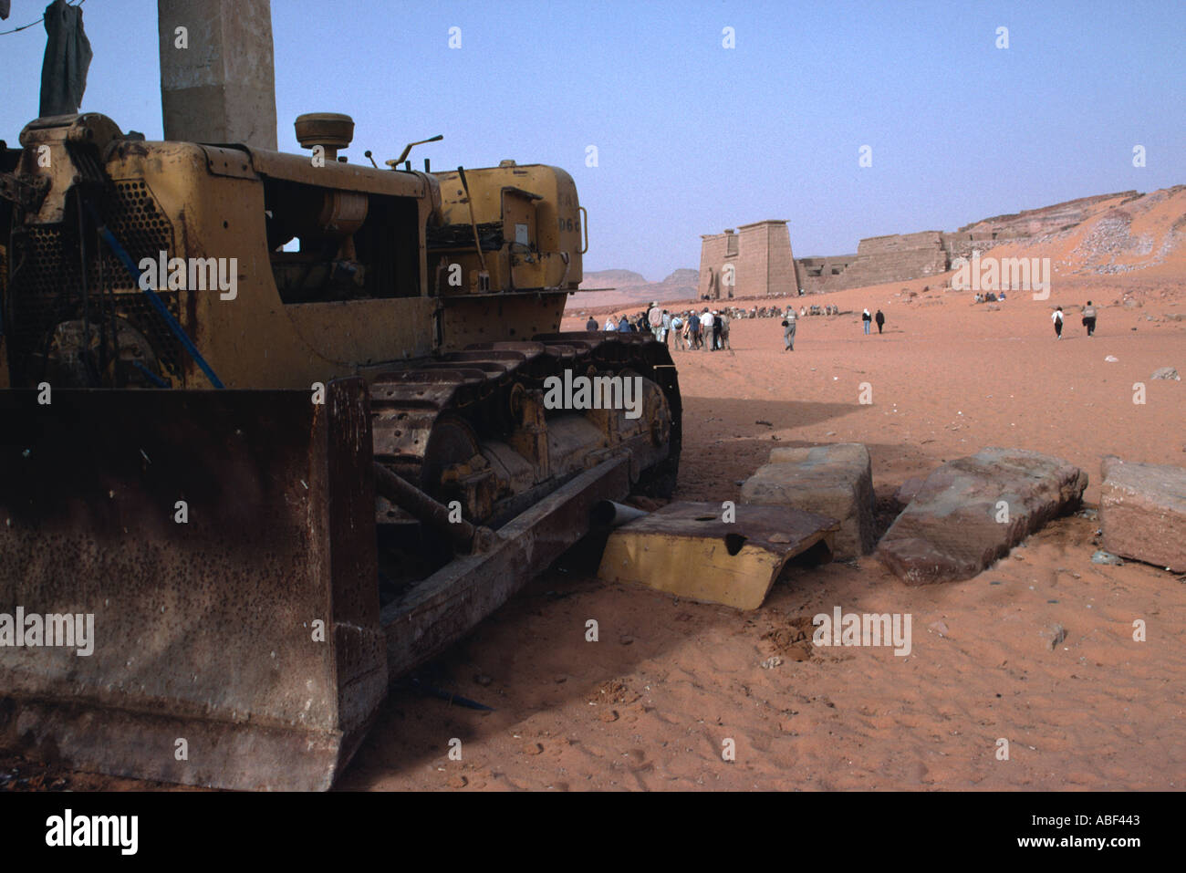 An old bulldozer. Wadi al-Sebua, New Sebua, Upper Egypt, Egypt. When the archeological sites were moved from the rising waters of Lake Nasser, one item of equipment was left at each location as a reminder of the the work that took place. This is in front of Wadi-el-sebua, one of Ramses II's temples. Stock Photo