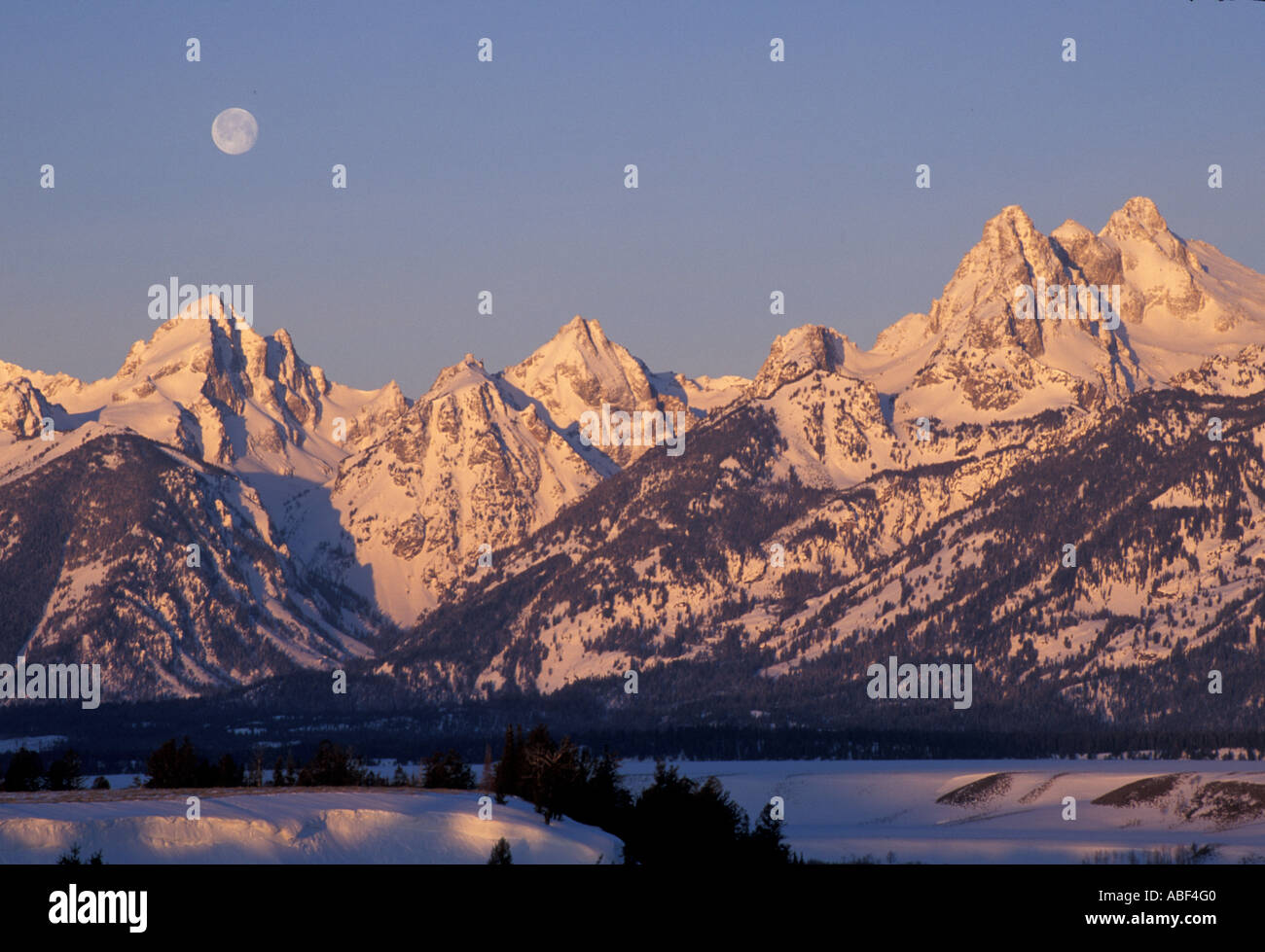 Snake River Overlook Grand Teton N P A full moon sets behind the Tetons