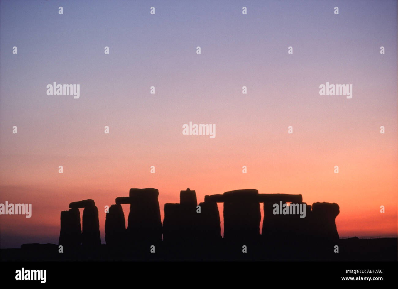 Sunset behind Stonehenge Nr Amesbury  Wiltshire England UK HOMER SYKES Stock Photo