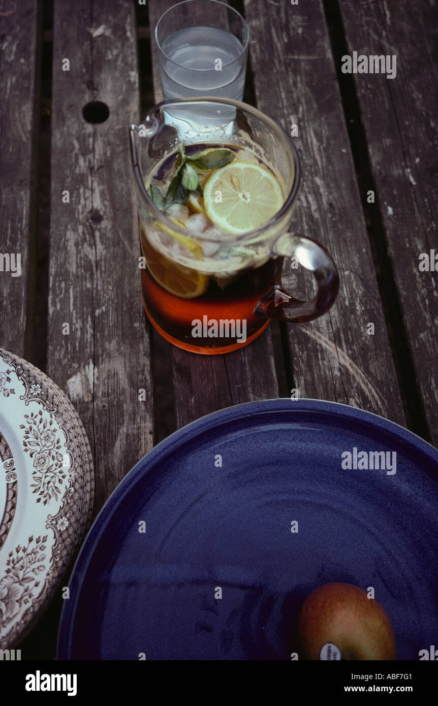 Glass jug of Pimms on summer evening tabletop england united kingdom uk