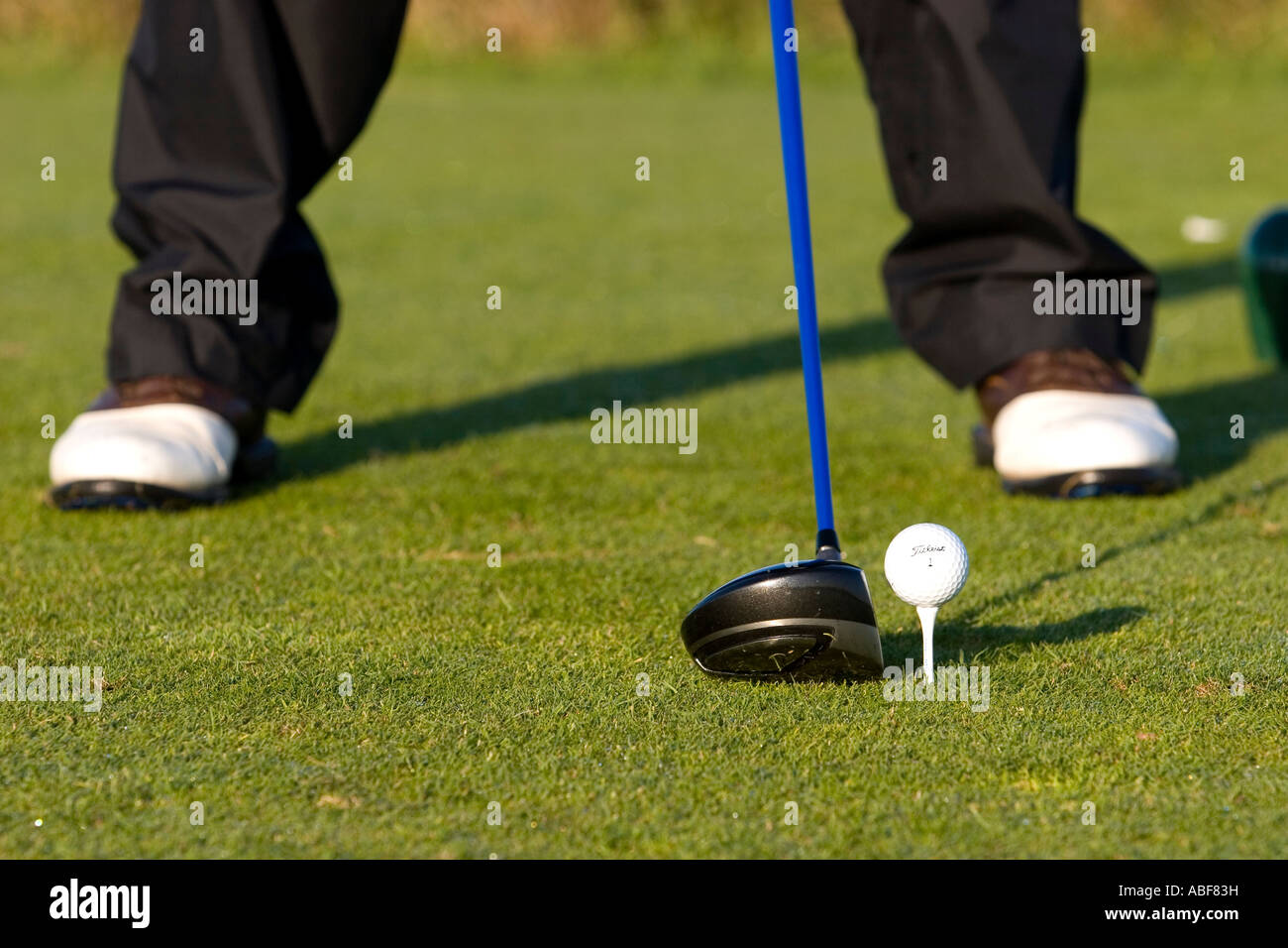 Golfer teeing off. Stock Photo