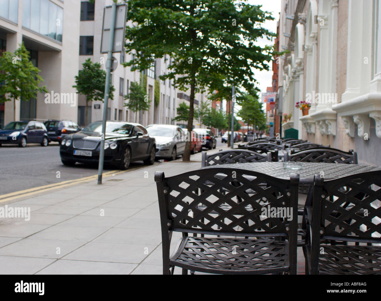 Tables and chairs in Belfast Street Stock Photo Alamy