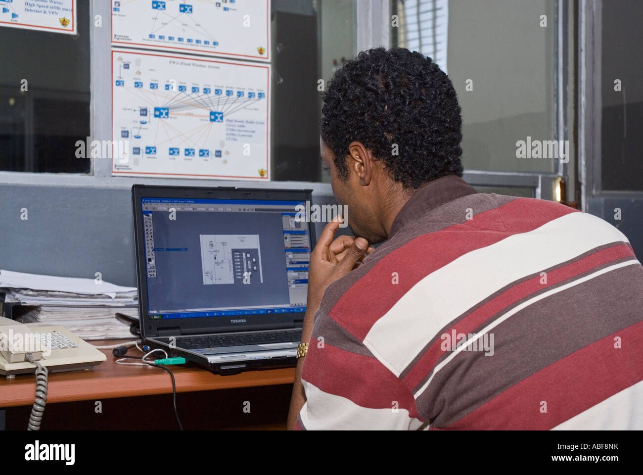 Man Studying Computer Screen, Ethiopian Authority