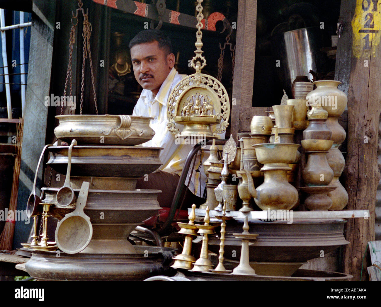 A young thirty year old man in an antique shop in Calicut Kerala Stock