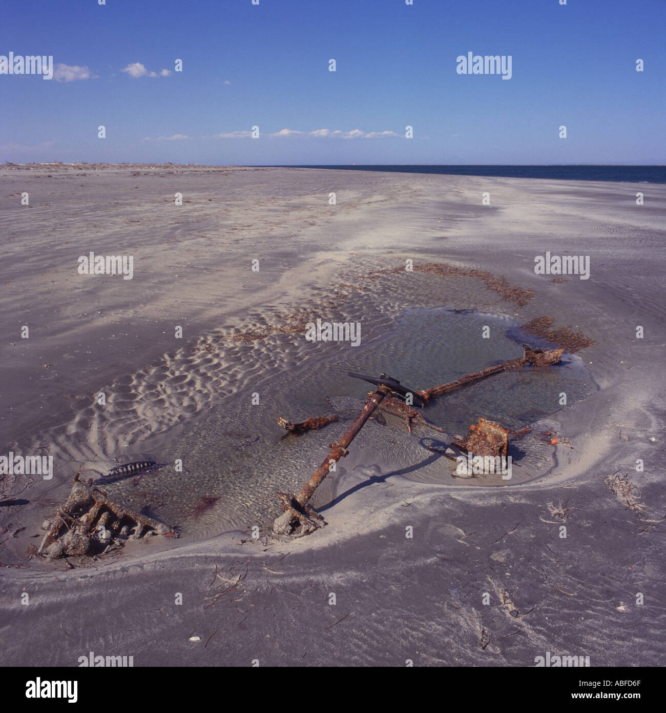 Rusting Remains of lost abandoned vehicle on deserted beach at San Ignacio Lagoon Baja California Sur Mexico Stock Photo