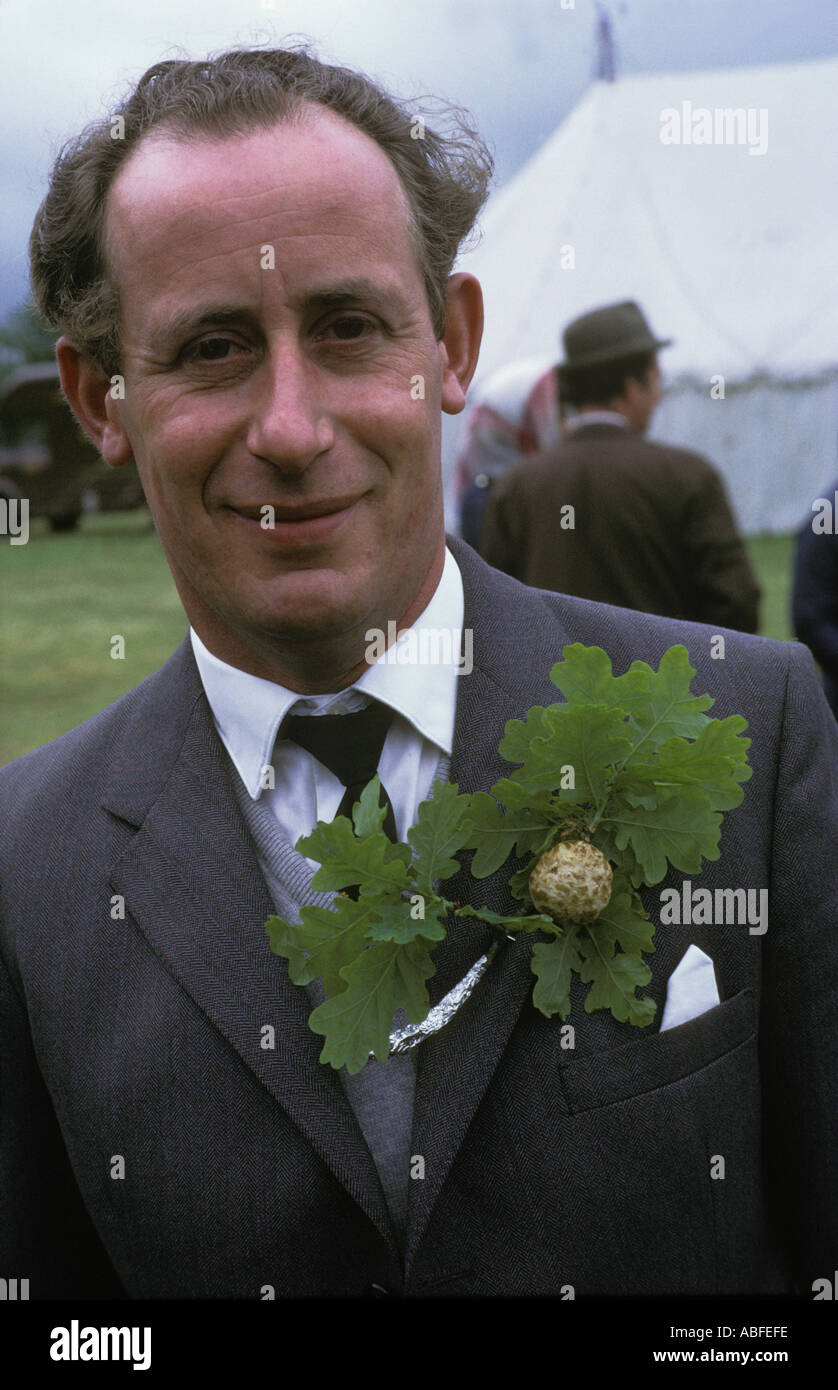 Oak Apple Day May29th village committee member wearing an oak apple at Grovely Forest Rights, Great Wishford Wiltshire 1970s  UK HOMER SYKES Stock Photo