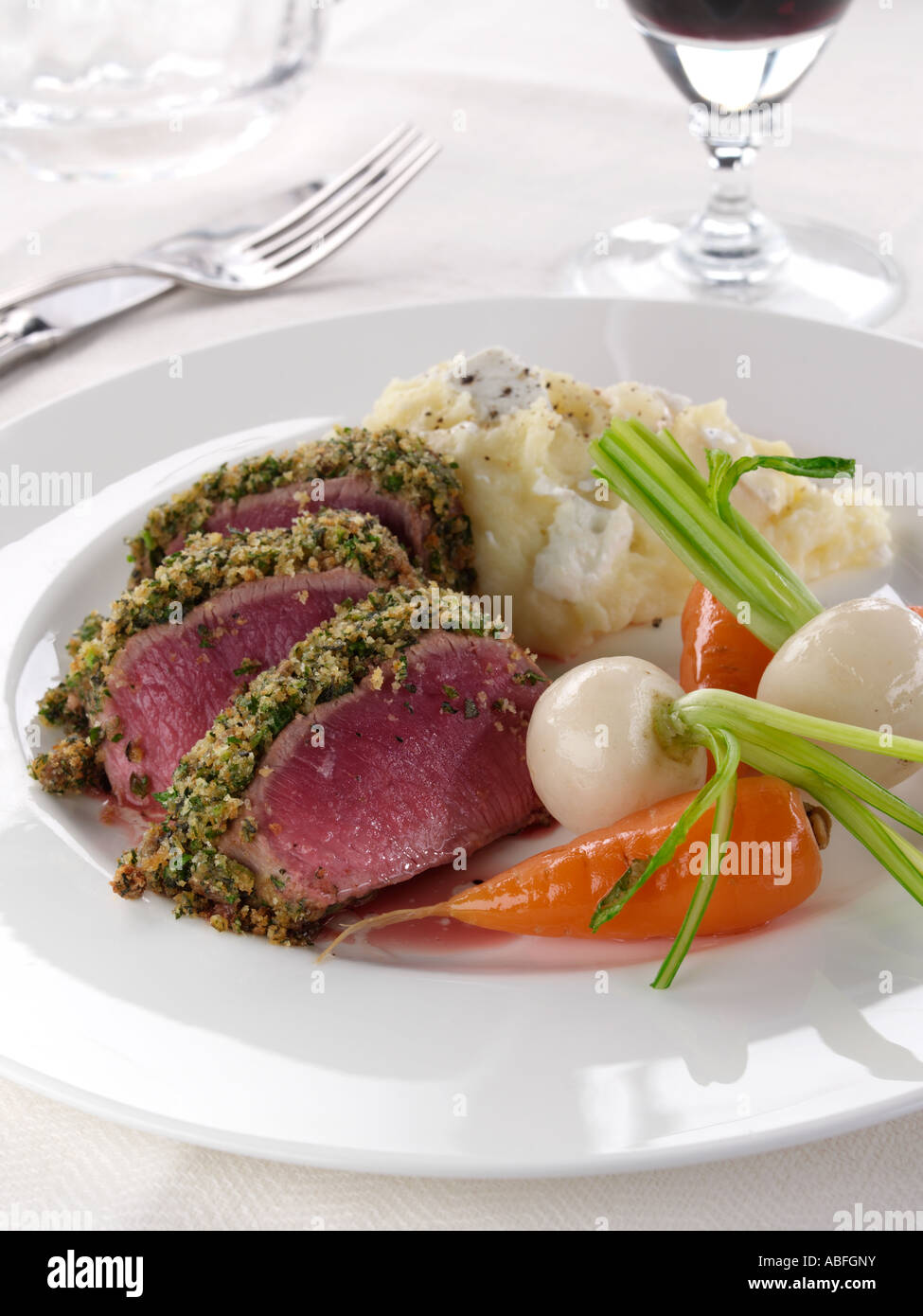 A plate of lamb loin in a herb crust with vegetables editorial food Stock Photo Alamy