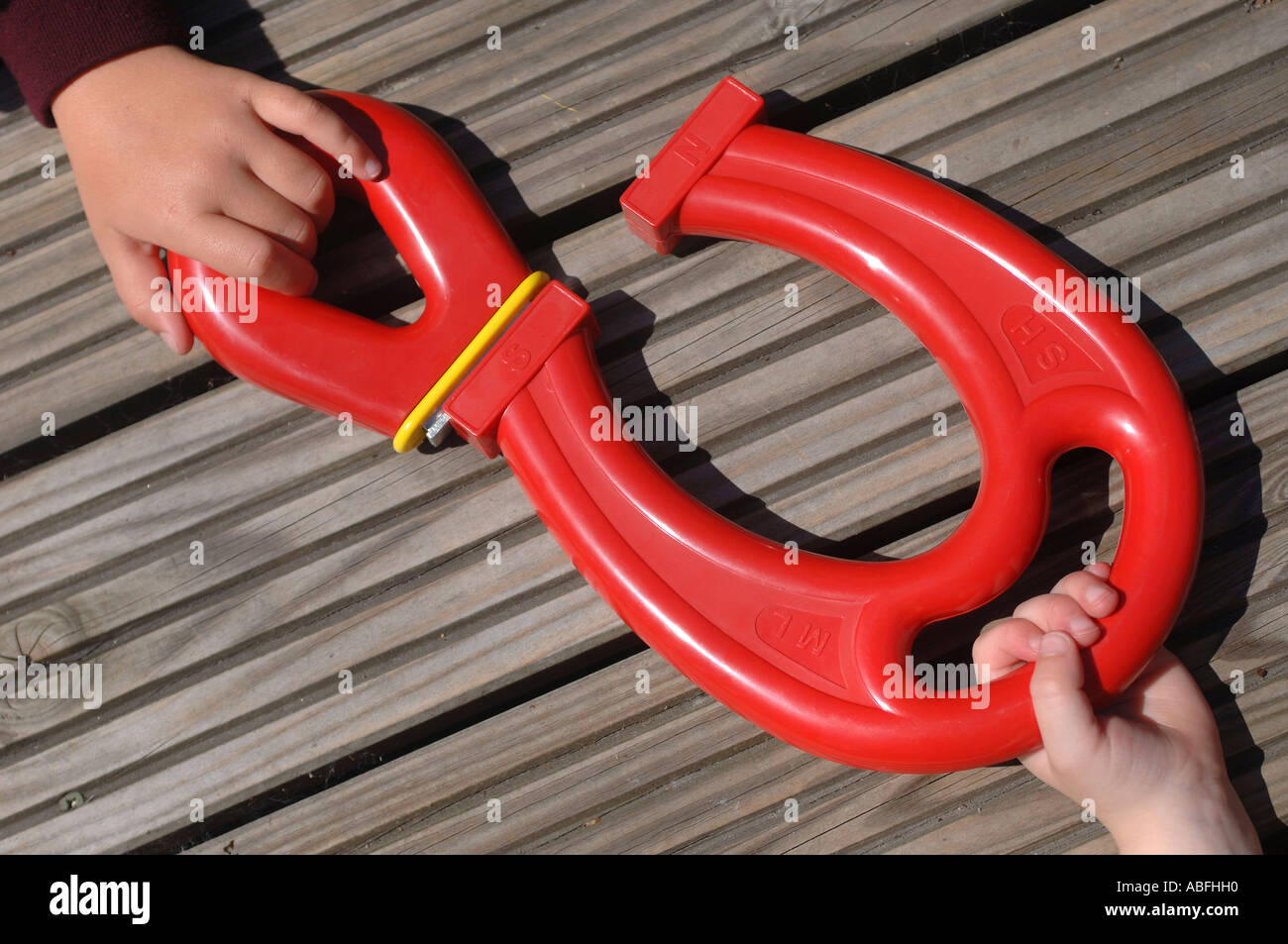 Children playing with large red plastic magnets at a nursery Stock ...
