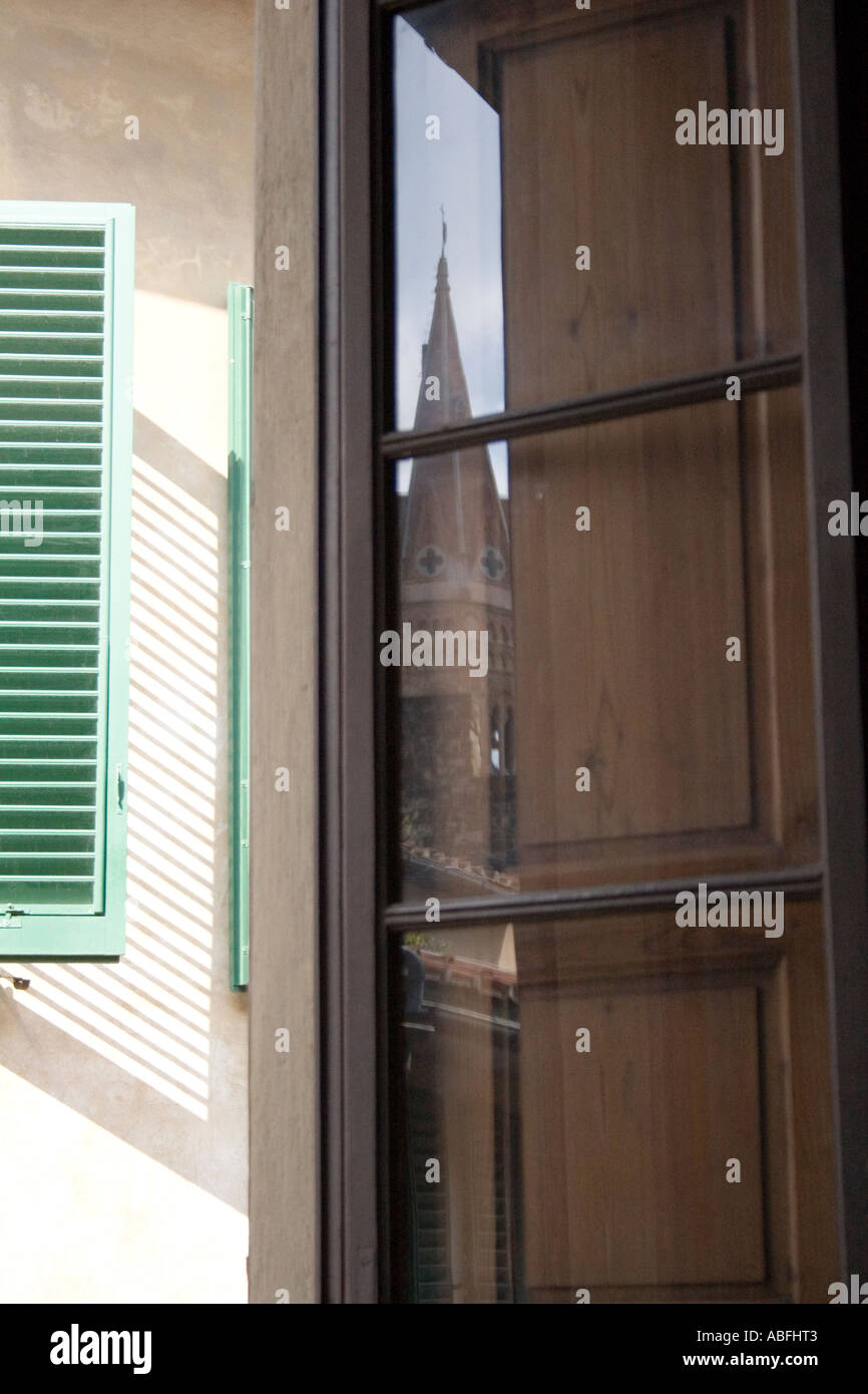 View of a window with reflection of a Renaissance spire, Florence ...