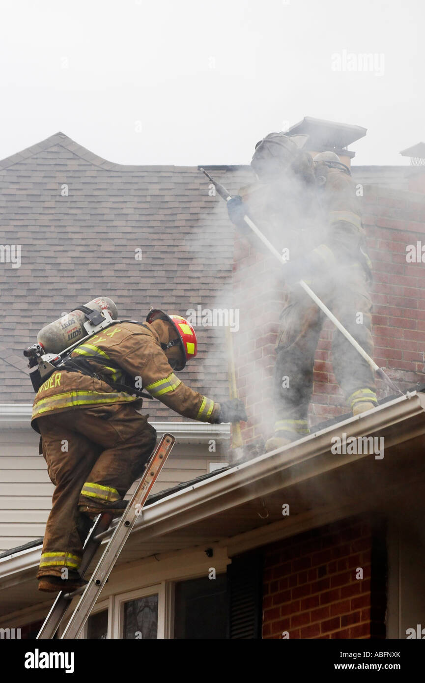 Firefighters climb ladder hires stock photography and images Alamy
