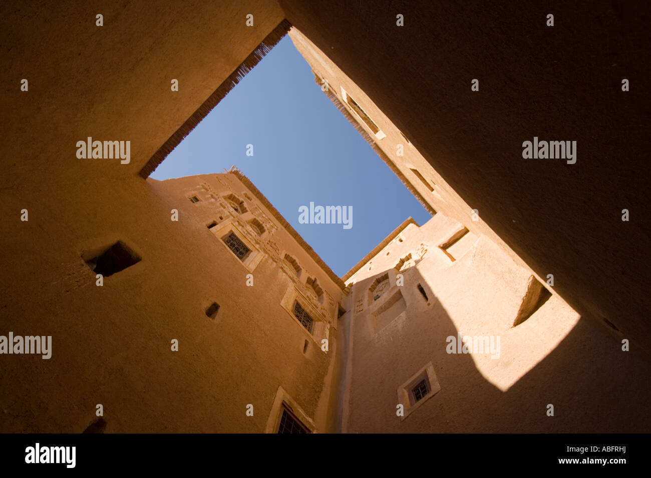 Buildings enclose courtyard open to sky Kasbah de Taourirt in Ouarzazate Morocco Stock Photo