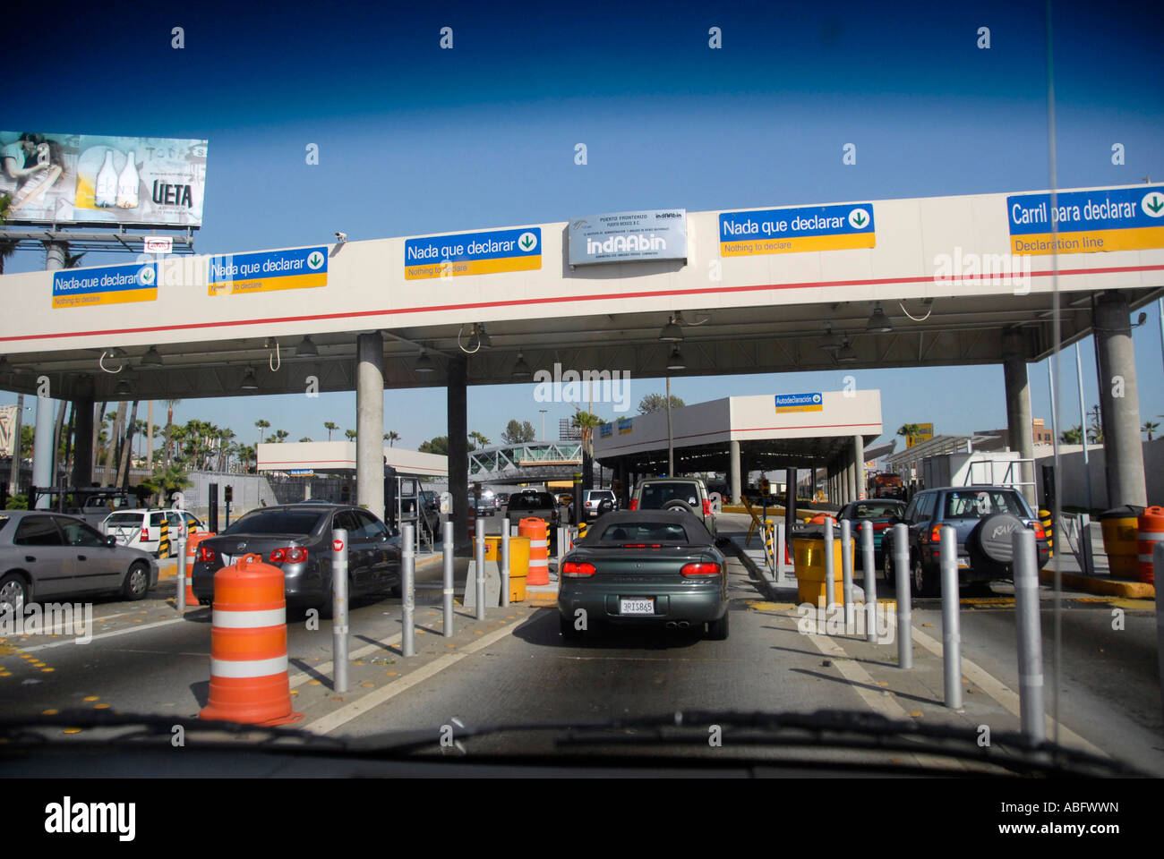 Cars enter Mexico from USA to Mexico through Interstate 5 border check station Stock Photo