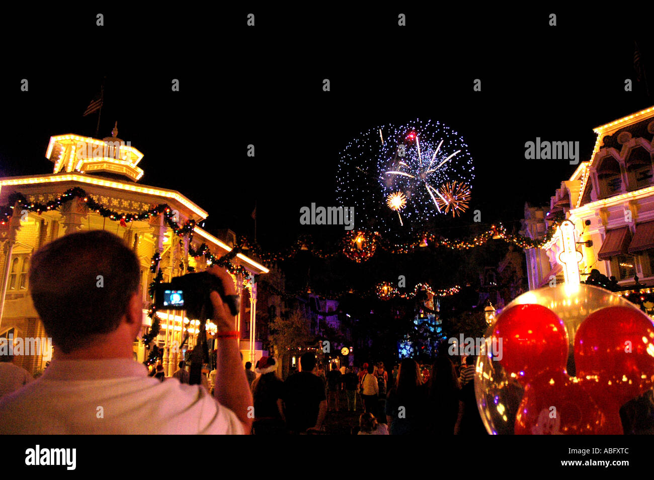 Florida Walt Disney World man taking photo of fireworks Stock Photo