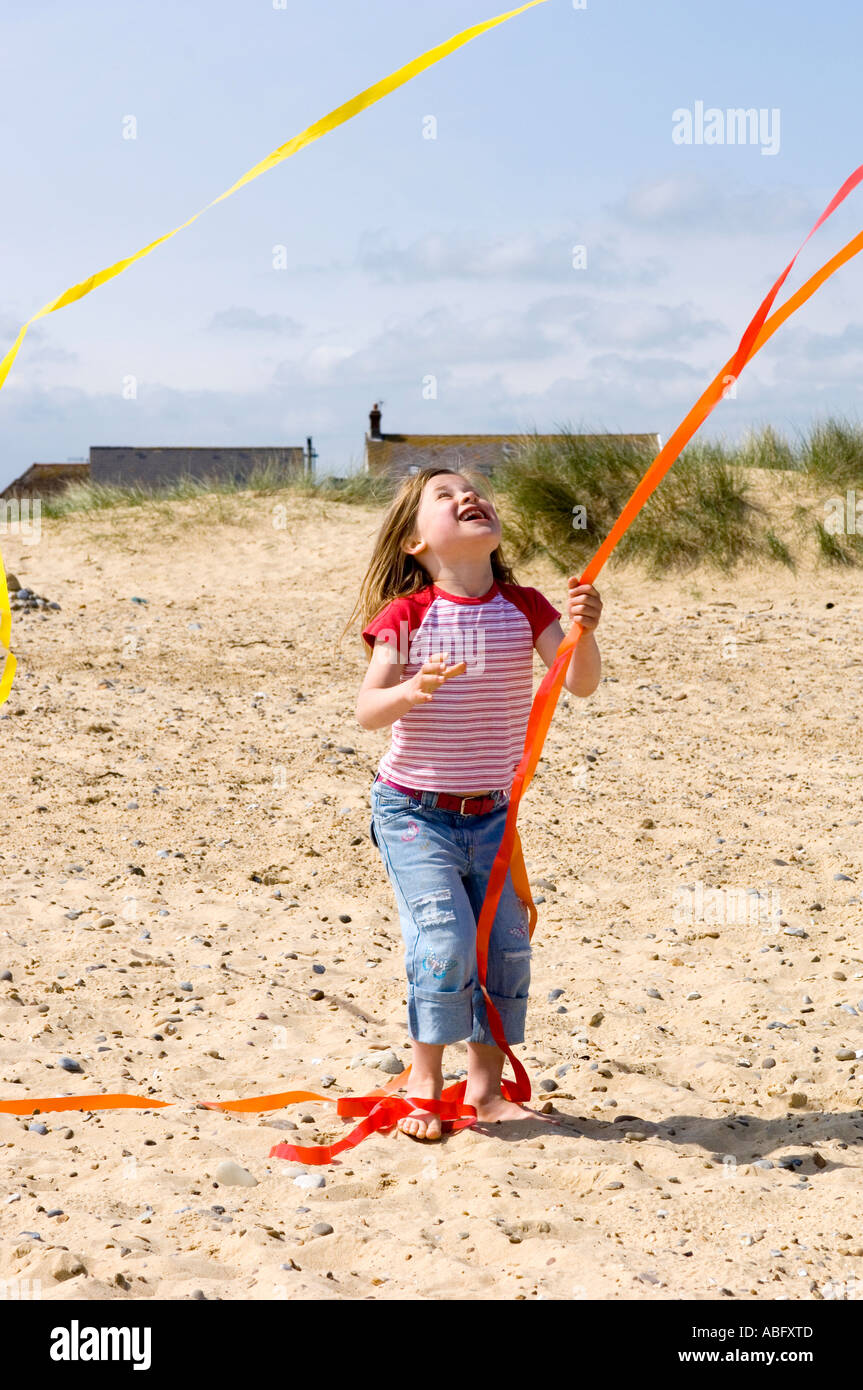 Young Girl Chasing Kite Tail Stock Photo Alamy