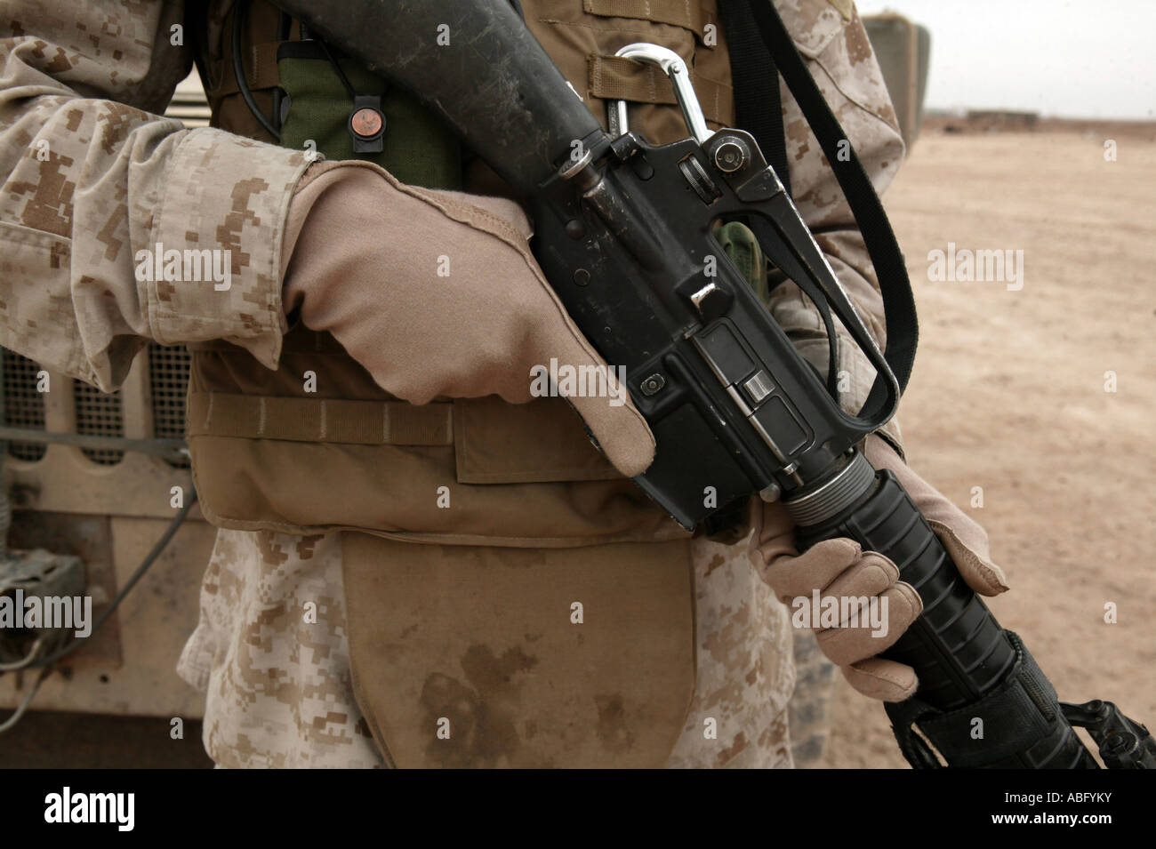 Camp Taqaddu, Iraq, January 13, 2006 - A Marine displays the required hand personal protective equipment. Stock Photo