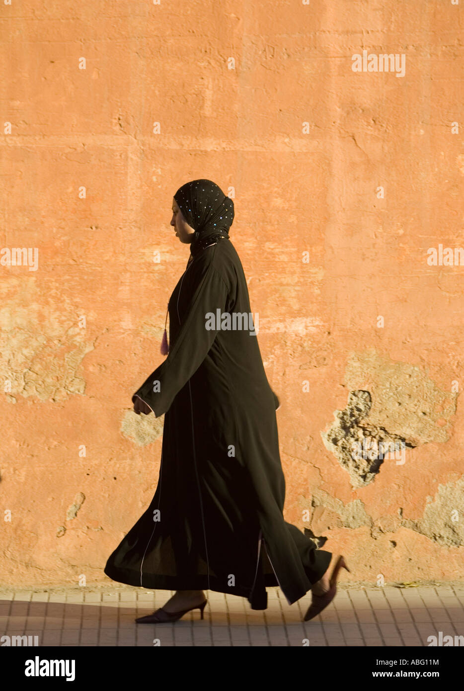 Woman pedestrian traditional black clothing Rue Fatima Zohra Marrakech  Morocco Stock Photo - Alamy