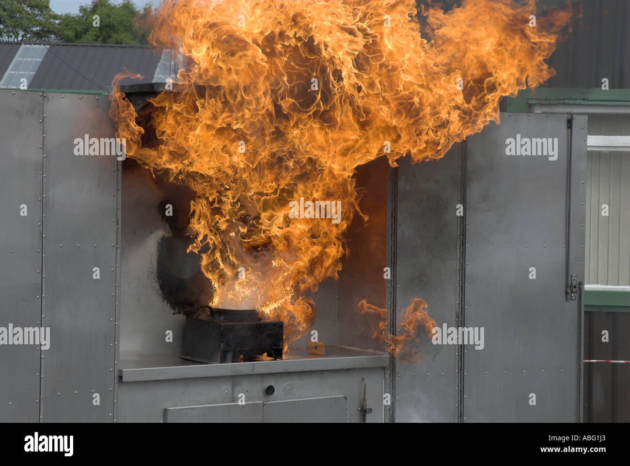 Chip Pan Fire Safety Demonstration by Fire Brigade Stock Photo