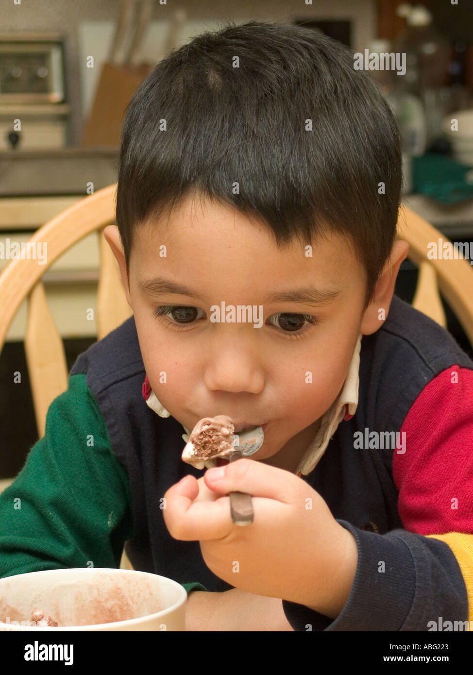 Three year old boy eating ice cream Stock Photo Alamy
