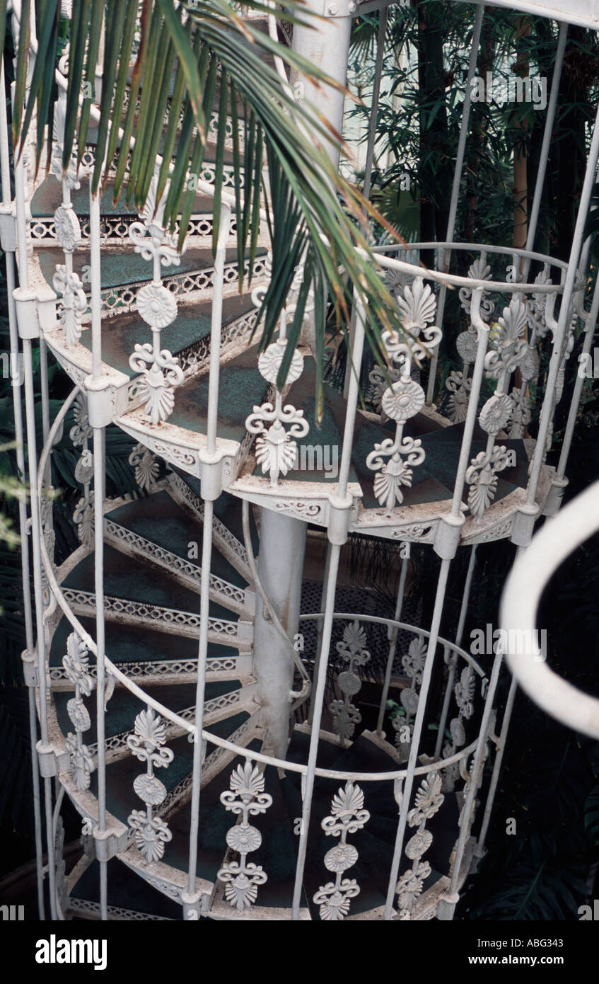Ornate iron spiral staircase in the palm house, Kew Gardens, Surrey, UK Stock Photo