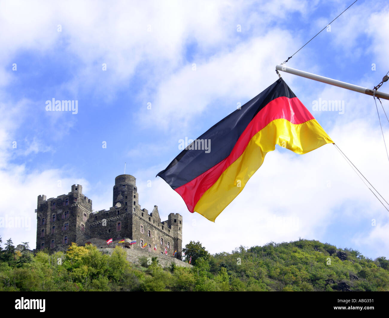 GERMANY Burg Maus Rhine Castle near St Sankt Goarshausen and german flag blowing blow in the wind  Stock Photo