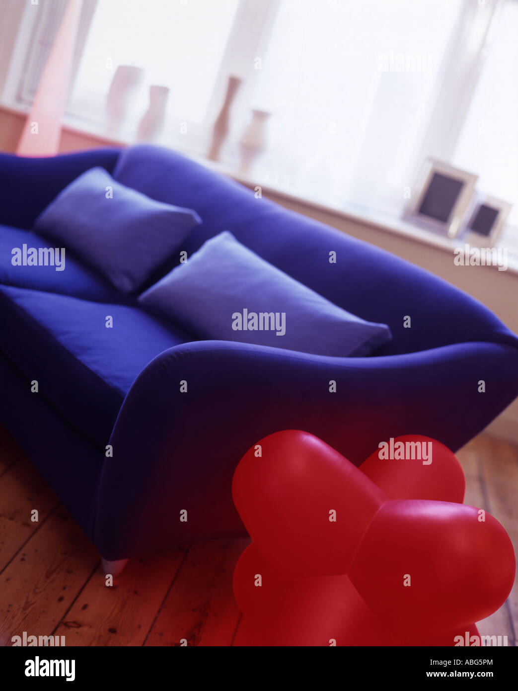 Blue sofa on wooden floor Stock Photo