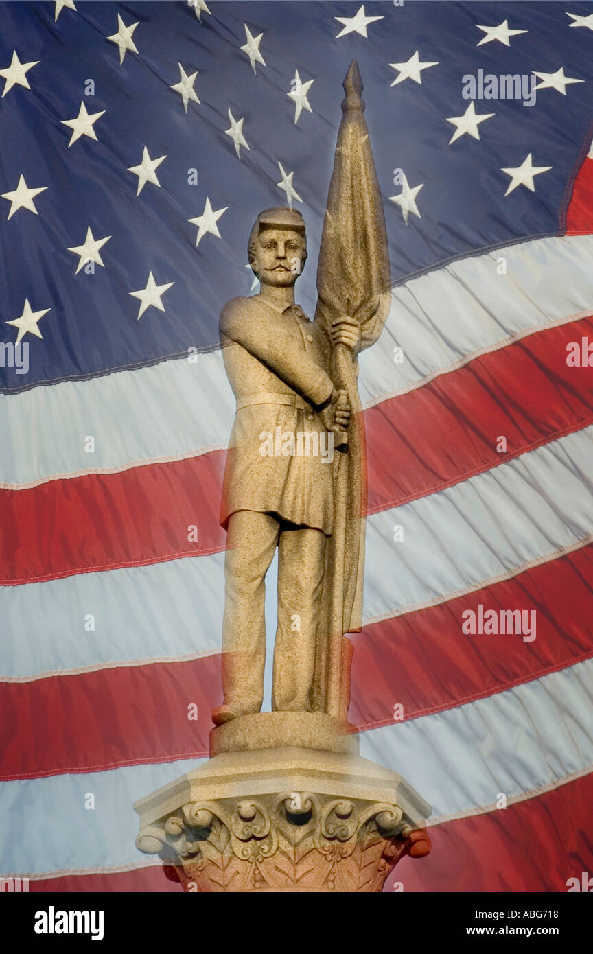 Civil war soldier statue stands in front of United States Flag Stock