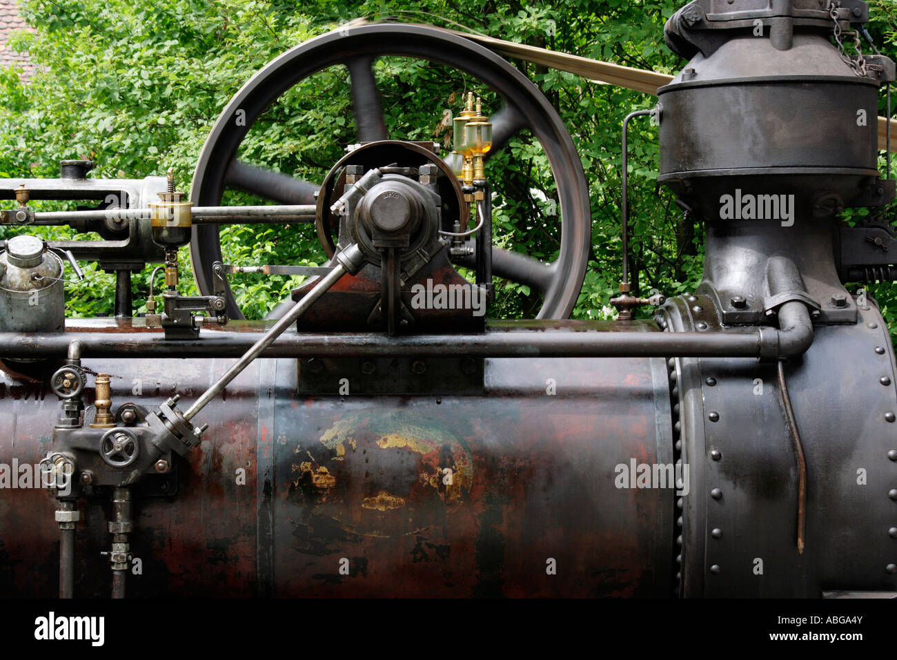 Flywheel, valves and rods of a historic steam engine Stock Photo