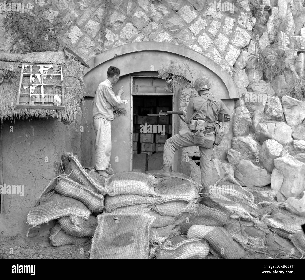 Korean civilian shows U. S. Marine dynamite cache near Inchon, South Korea. Stock Photo