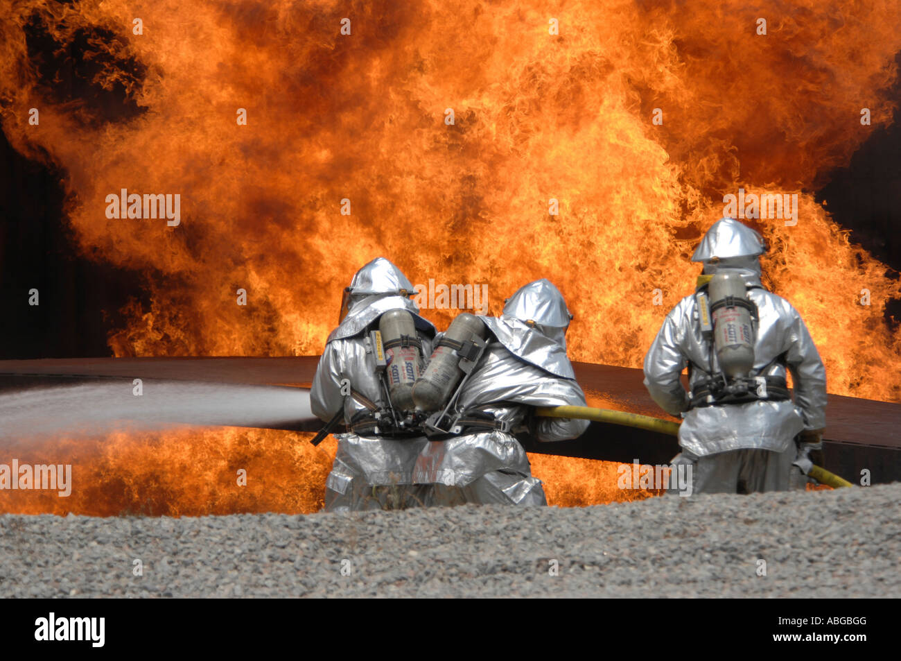 U.S. Air Force Airmen neutralize a live fire during a field training exercise. Stock Photo