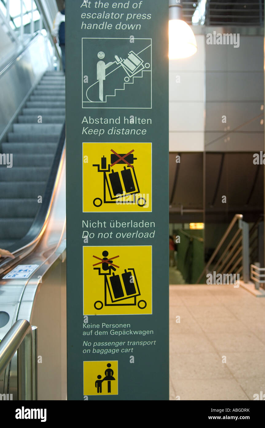 Display panels for using escalators, airport, Germany Stock Photo Alamy