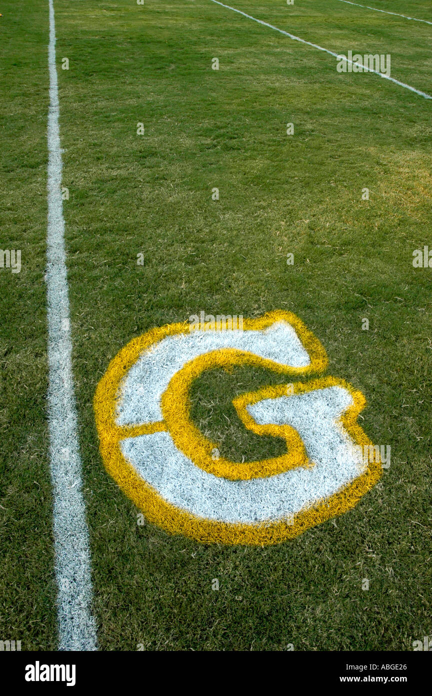 Goal touchdown win Painting yardage numbers and logos on football