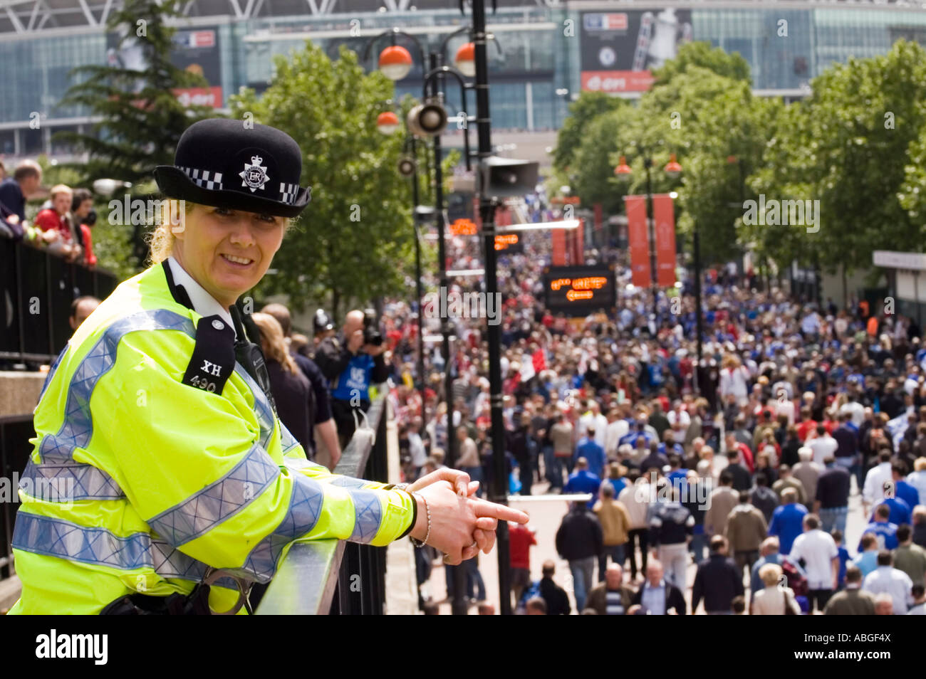 British police is watching over the football supporters They are going to the FA cup final in Wembley stadium Stock Photo