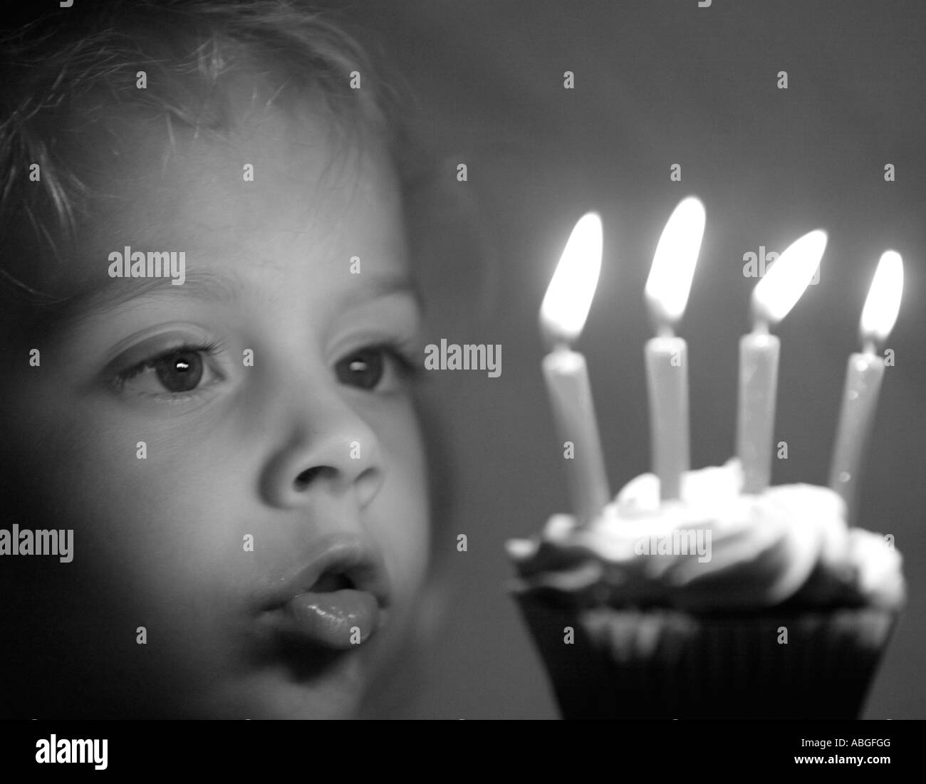 Child ready to blow out birthday candles Stock Photo