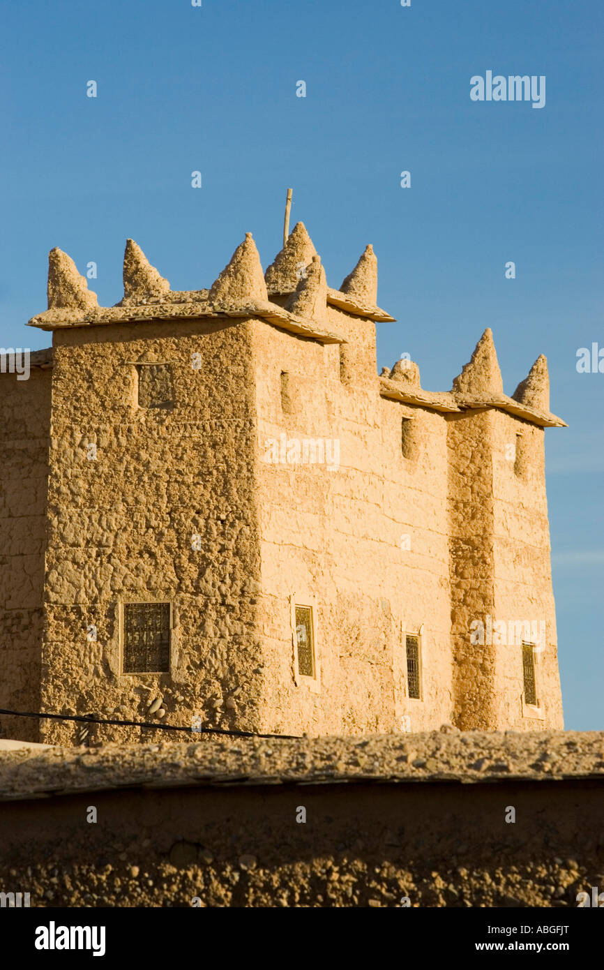 Berber style pointed turret mud brick building Nekob Morocco Stock Photo