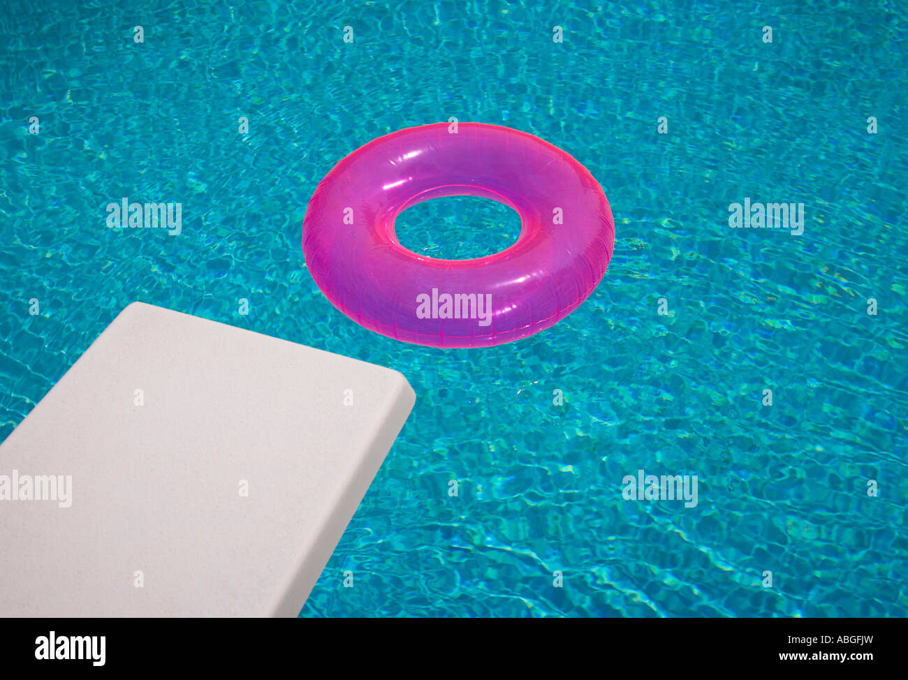 Diving board and inflatable ring in a pool Stock Photo Alamy