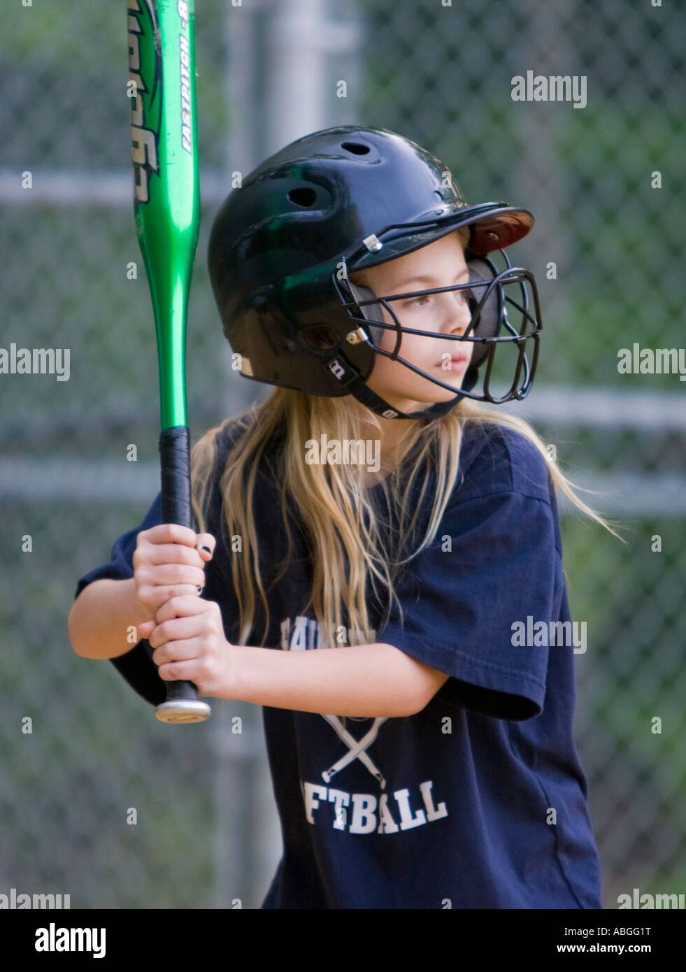 Girl getting ready to hit a softball Stock Photo Alamy