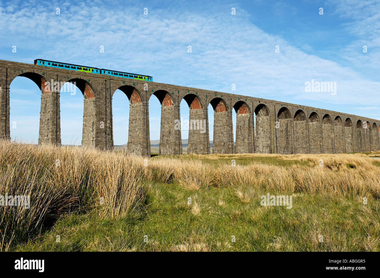 Two car sprinter crossing Ribblehead viaduct Stock Photo