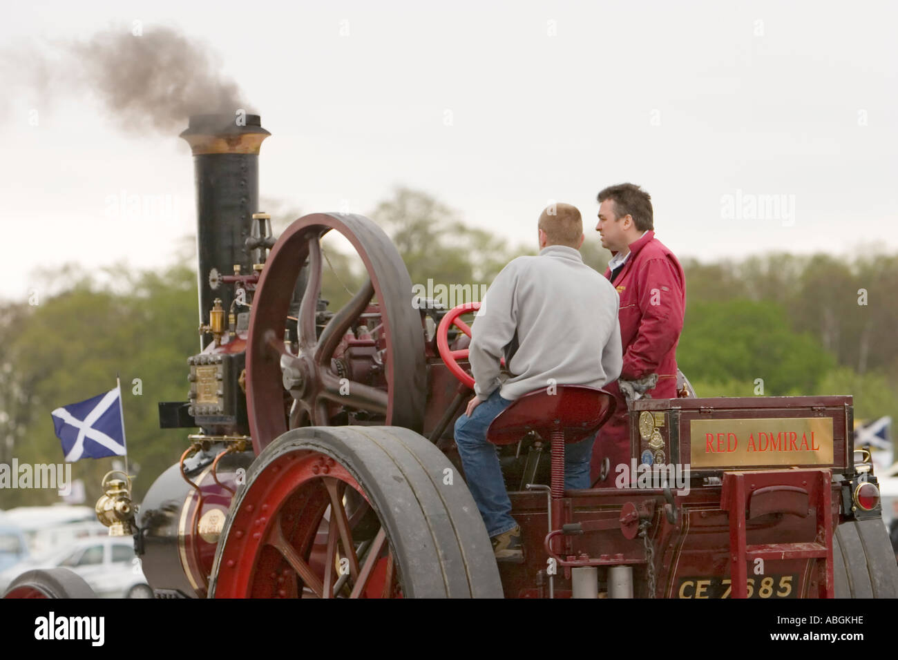 Men driving 1914 Clayton and Shuttleworth Red Admiral full size steam traction engine Stock Photo