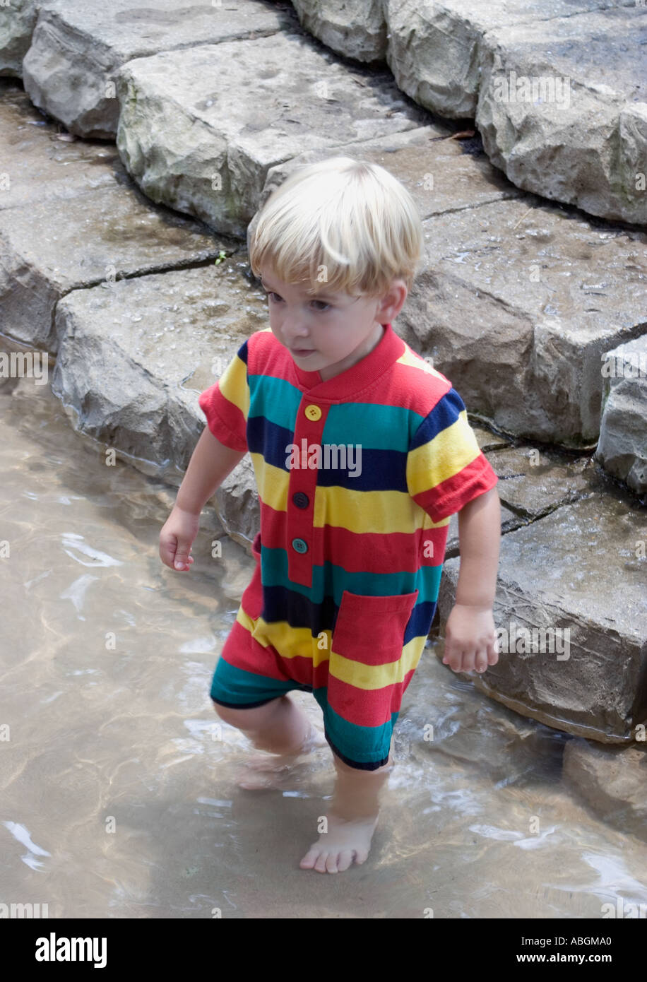 Little guy in water fountain Stock Photo Alamy