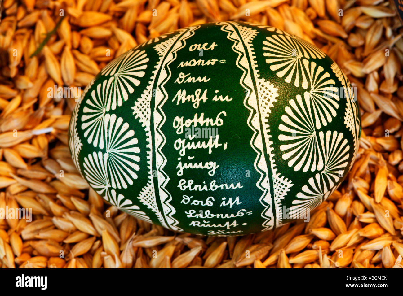 In traditional Hessian batik technique painted and dyed green easter egg Stock Photo