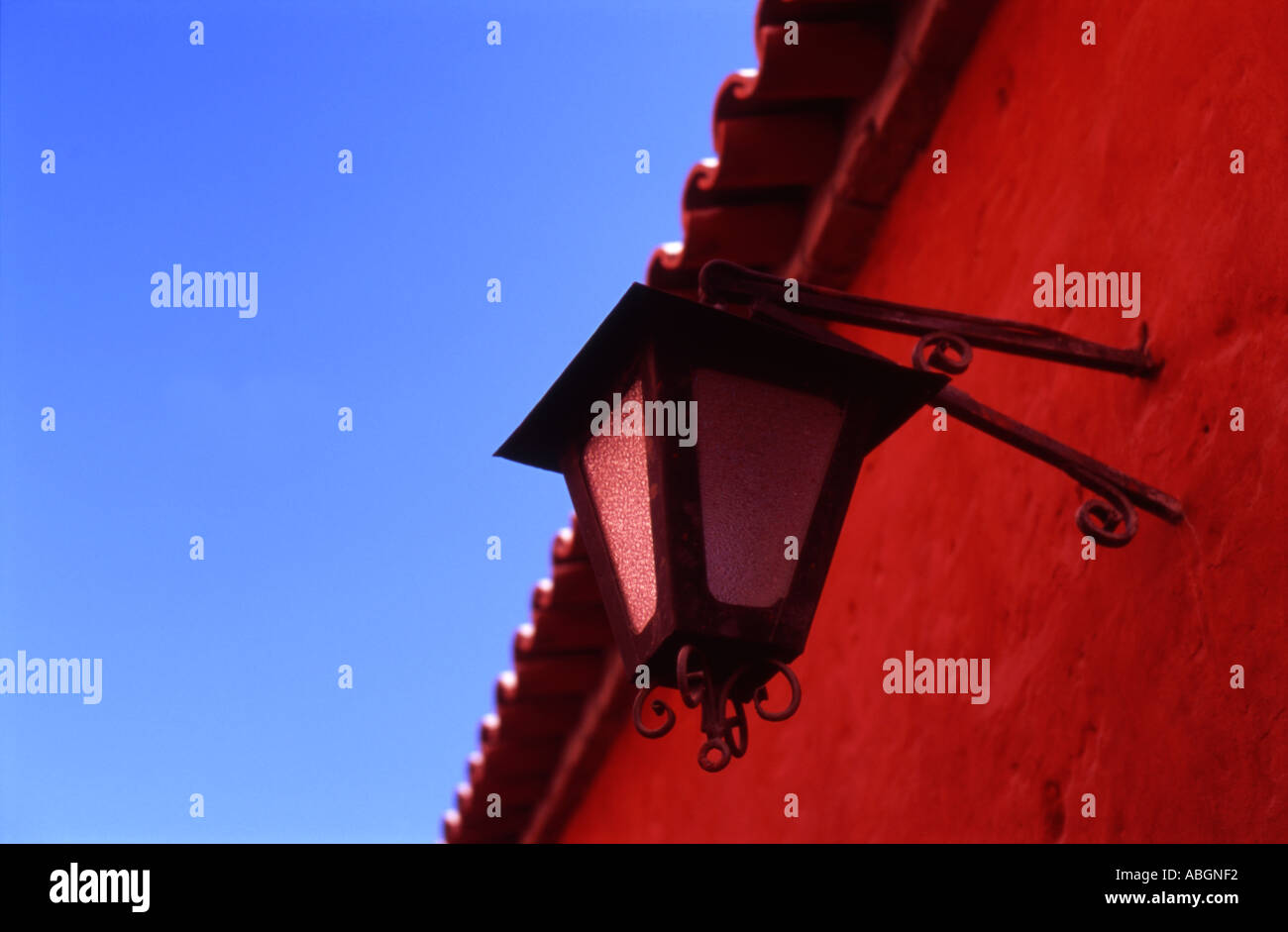 Lantern on red wall beneath blue sky Arequipa Peru Stock Photo - Alamy